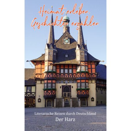 Historisches Gebäude mit Türmchen und bunten Fenstern im Ortszentrum.