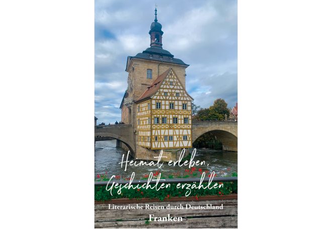 Fachwerkhaus mit Turm und Wasseransicht in Bamberg, Deutschland.