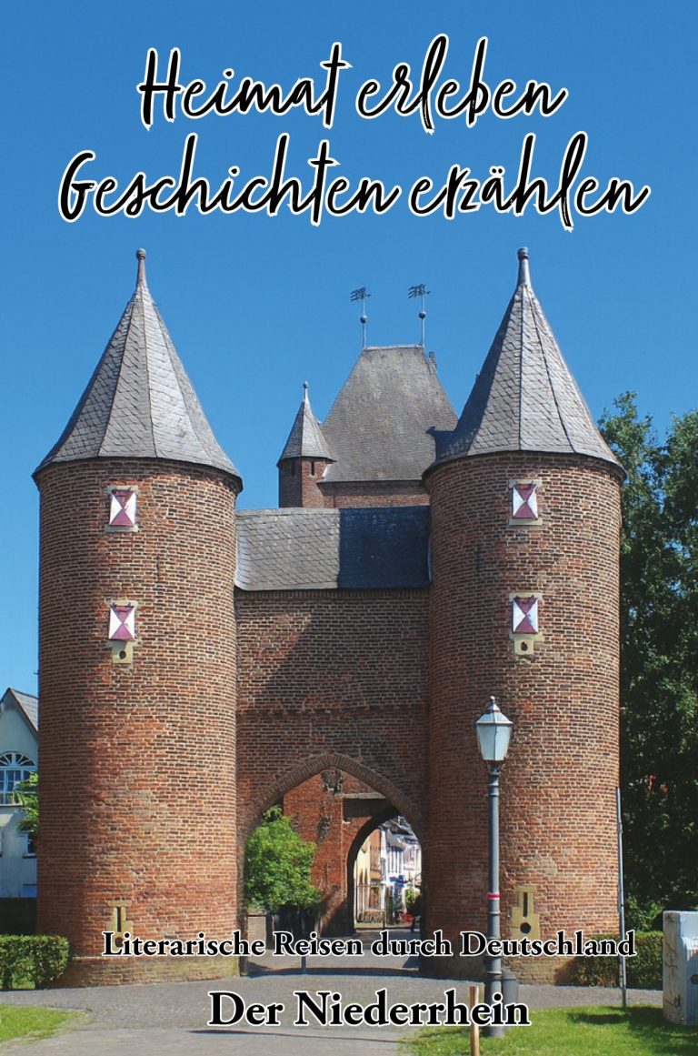 Ein Frau sitzt an einem Tisch mit Büchern und Glücksmomenten, umgeben von bunten Deko-Elementen.