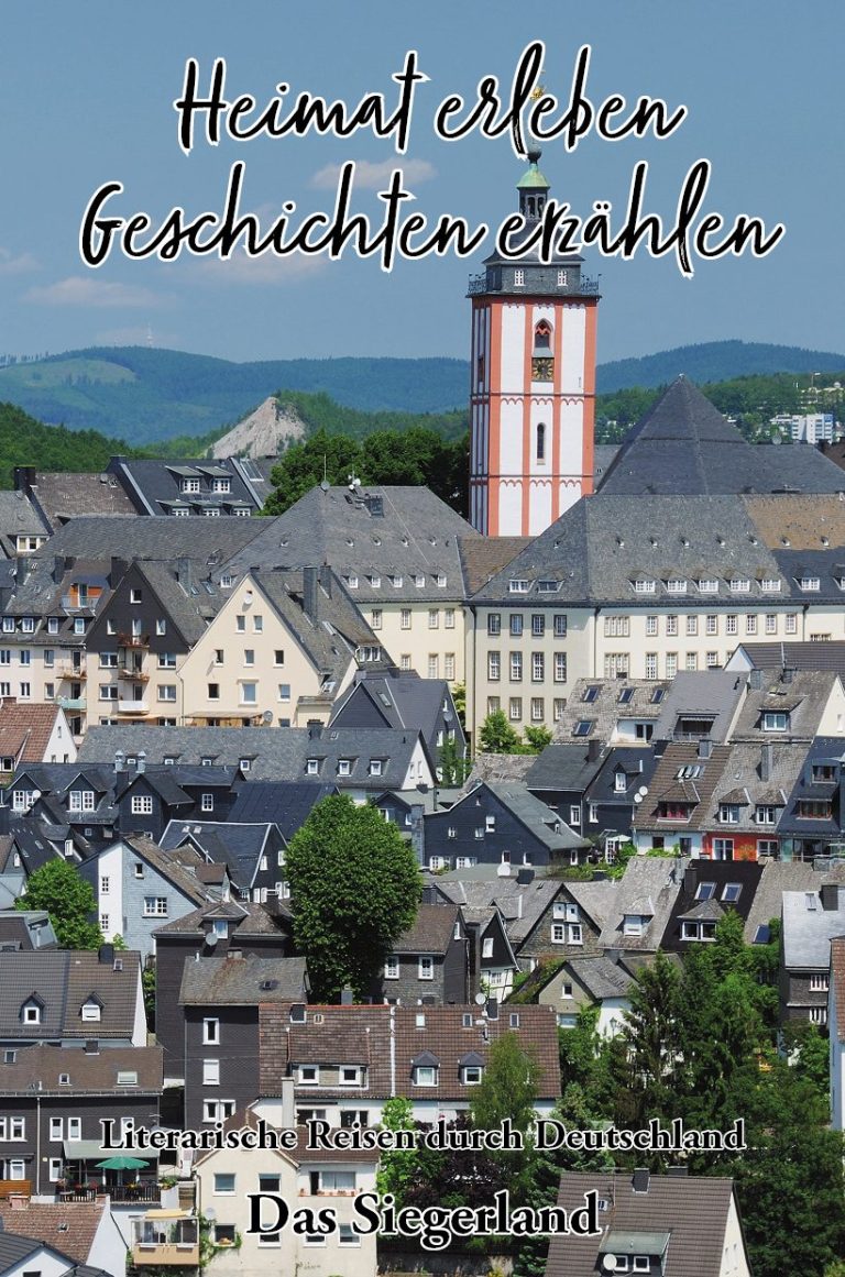 Ein Frau sitzt an einem Tisch mit Büchern und Glücksmomenten, umgeben von bunten Deko-Elementen.